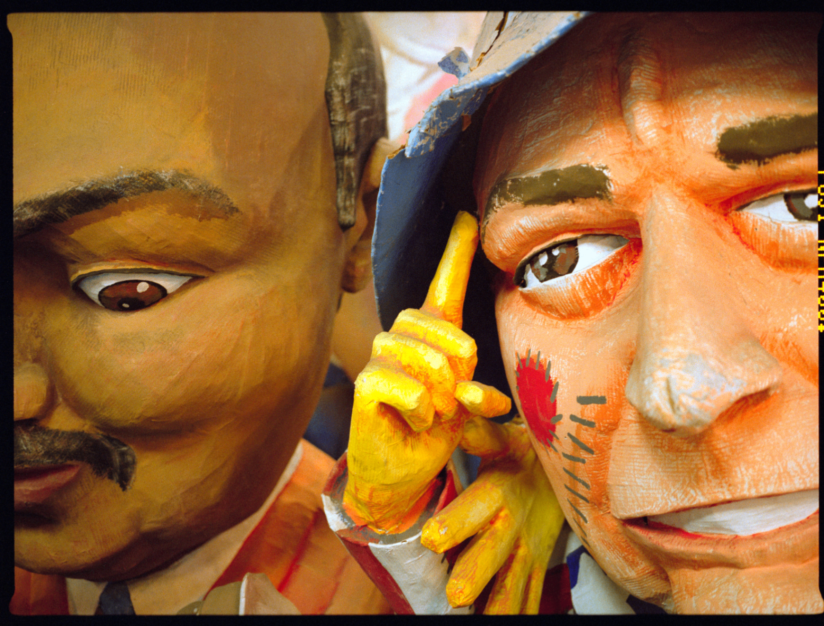 Colorful close-up of Mardi Gras-style parade figures