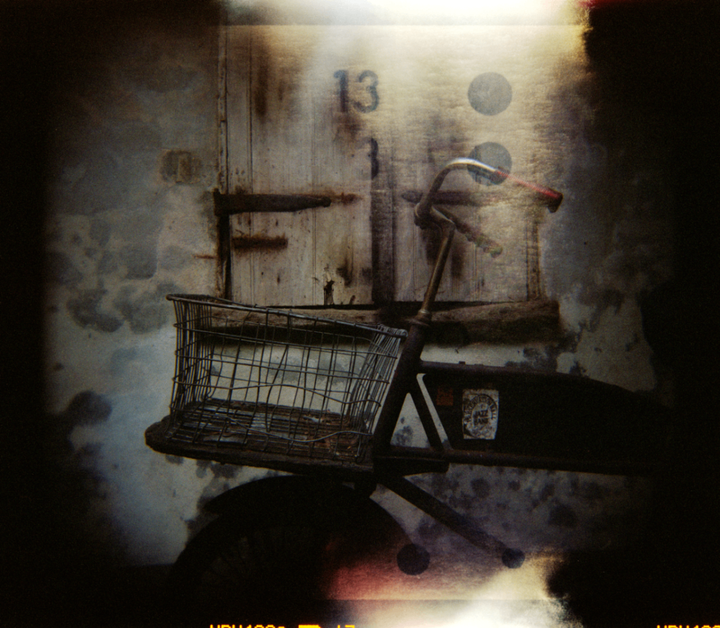 Bicycle basket in front of a weathered doorway in New Orleans